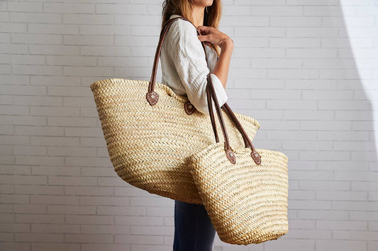 Basket with Brown Leather Handles Over the Shoulder