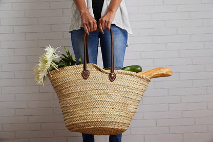 Basket with Brown Leather Handles Over the Shoulder